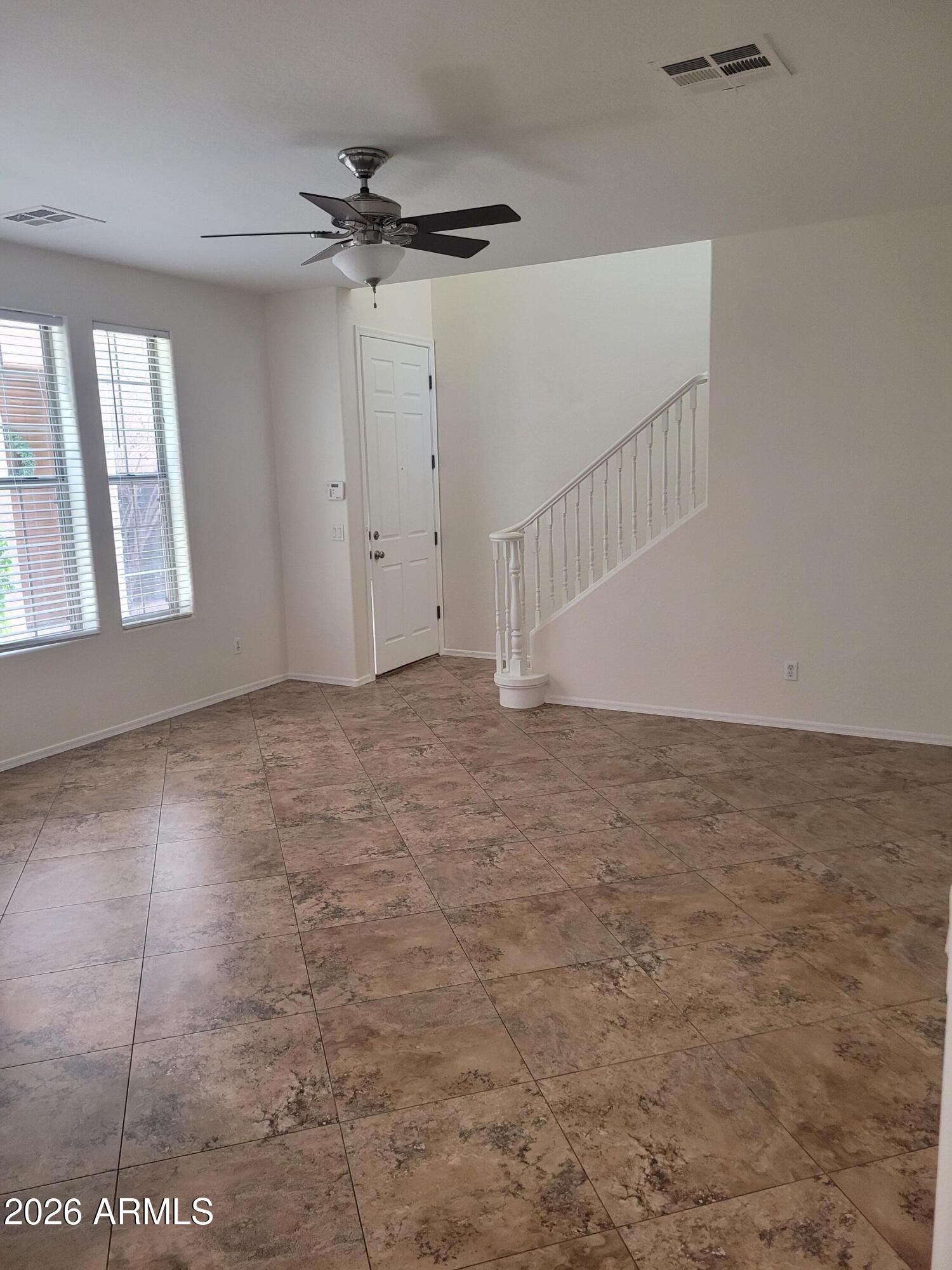 1453 South Sinova Avenue Gilbert, AZ 85296 - Photo 18 of 46 a view of an empty room with a window