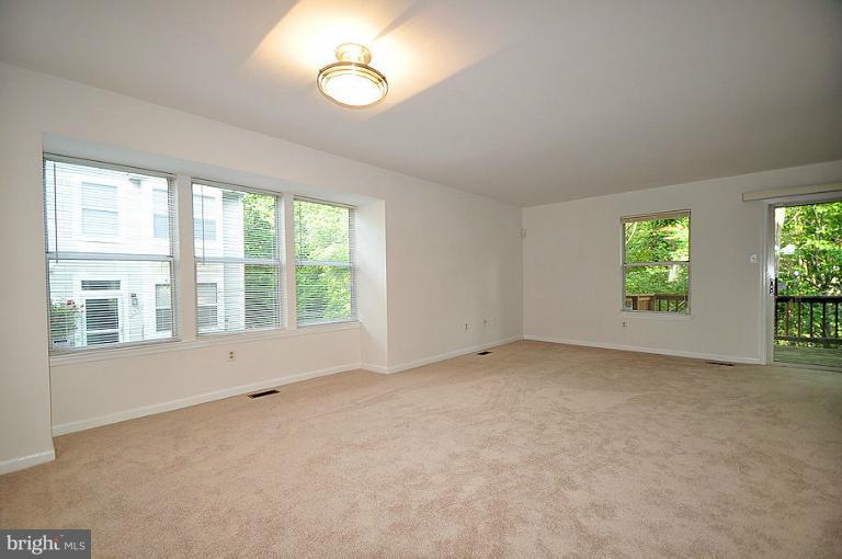 9537 Clocktower Lane Columbia, MD 21046 - Photo 4 of 16 an empty room with windows