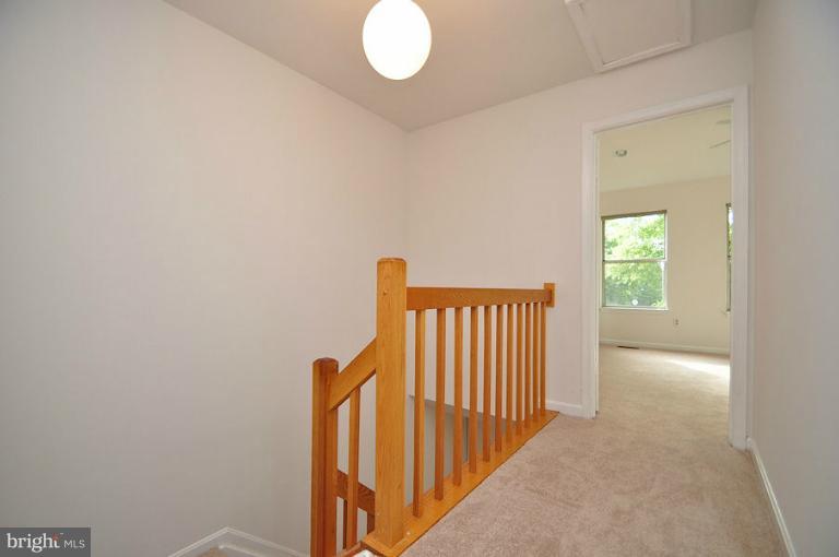 9537 Clocktower Lane Columbia, MD 21046 - Photo 6 of 16 a view of a hallway with a window