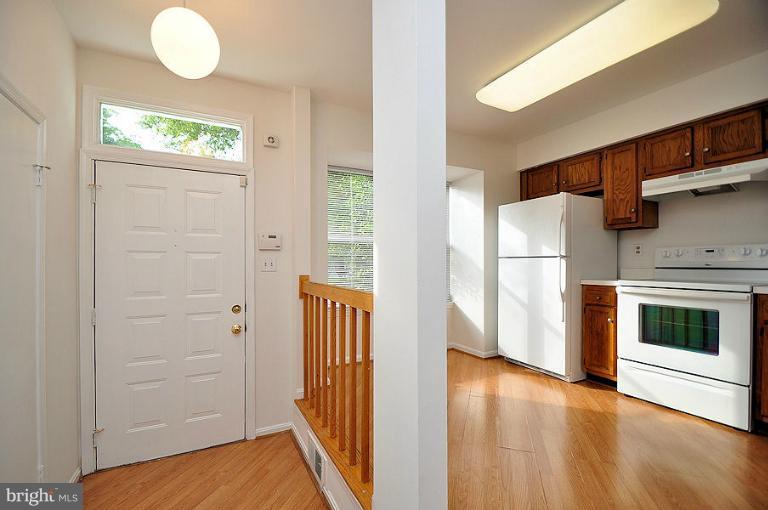 9537 Clocktower Lane Columbia, MD 21046 - Photo 9 of 16 a view of a livingroom with wooden floor and a fireplace