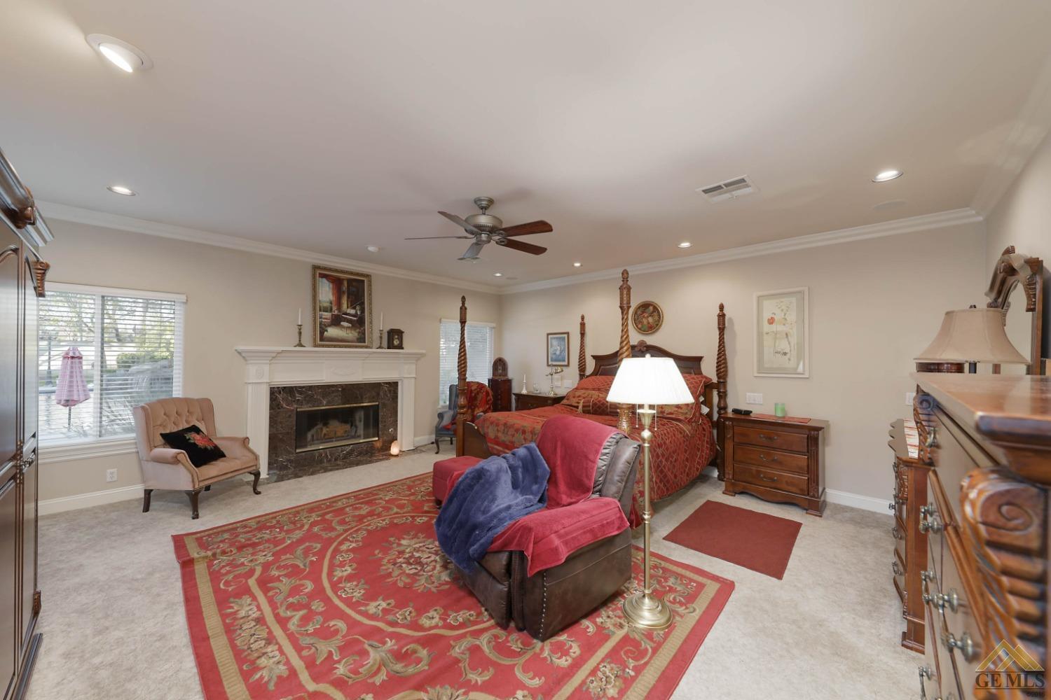 Undisclosed Address Bakersfield, CA 93312 - Photo 12 of 48 a living room with furniture fireplace and window
