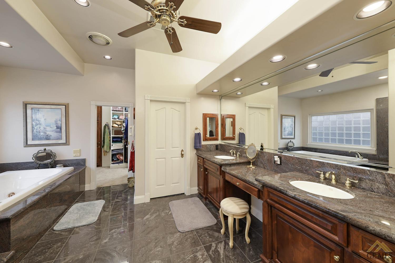 Undisclosed Address Bakersfield, CA 93312 - Photo 15 of 48 a kitchen with granite countertop a sink and stove