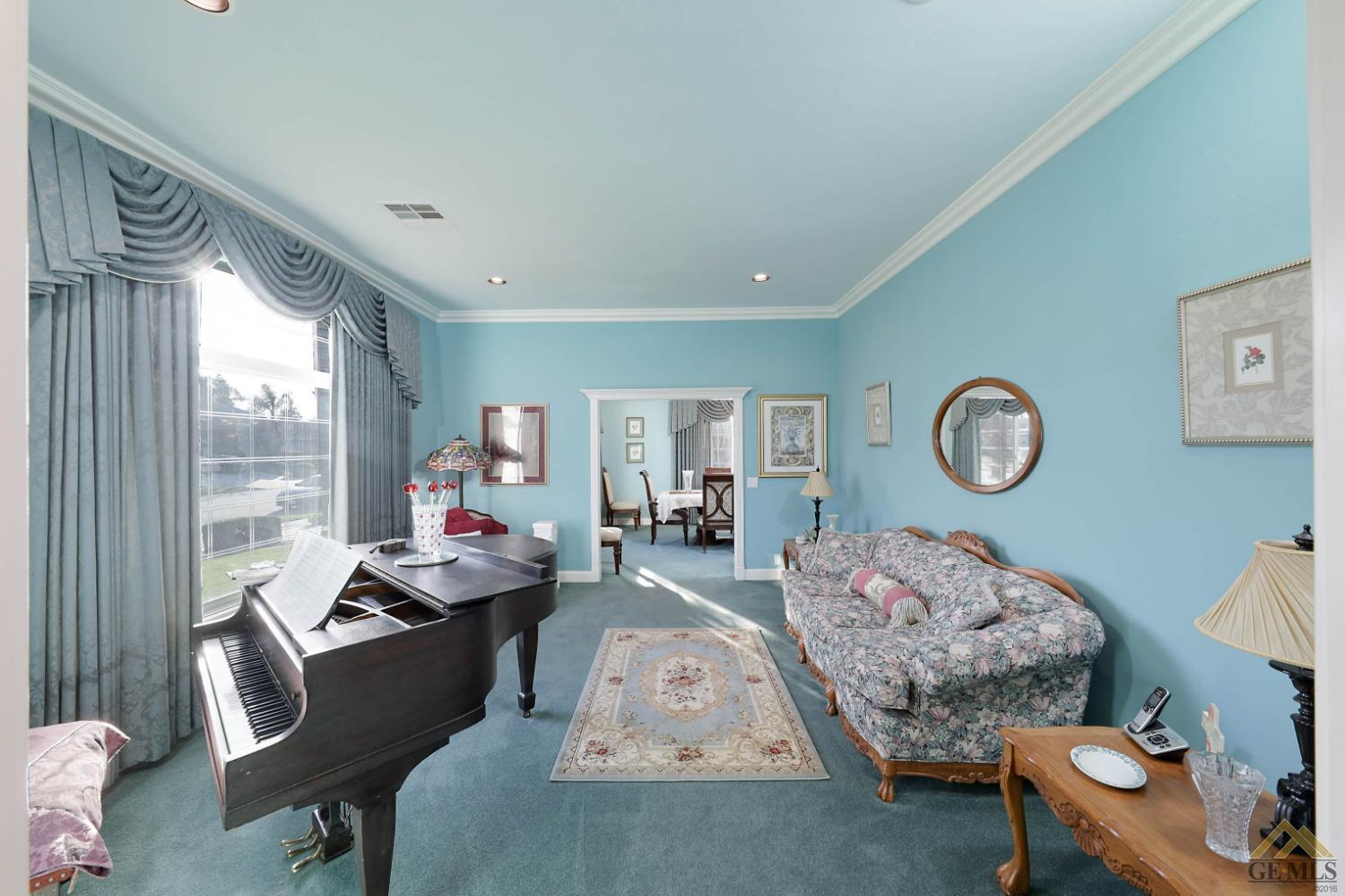 Undisclosed Address Bakersfield, CA 93312 - Photo 18 of 48 a living room with furniture and a window