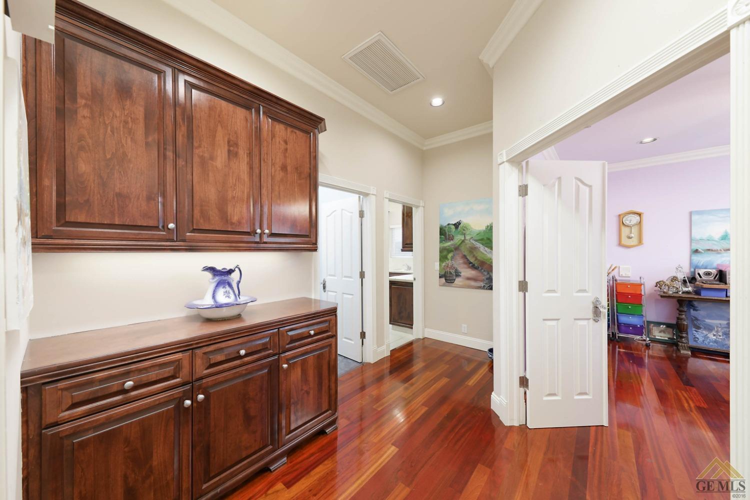 Undisclosed Address Bakersfield, CA 93312 - Photo 20 of 48 a kitchen with stainless steel appliances granite countertop a refrigerator a stove top oven and wooden floors