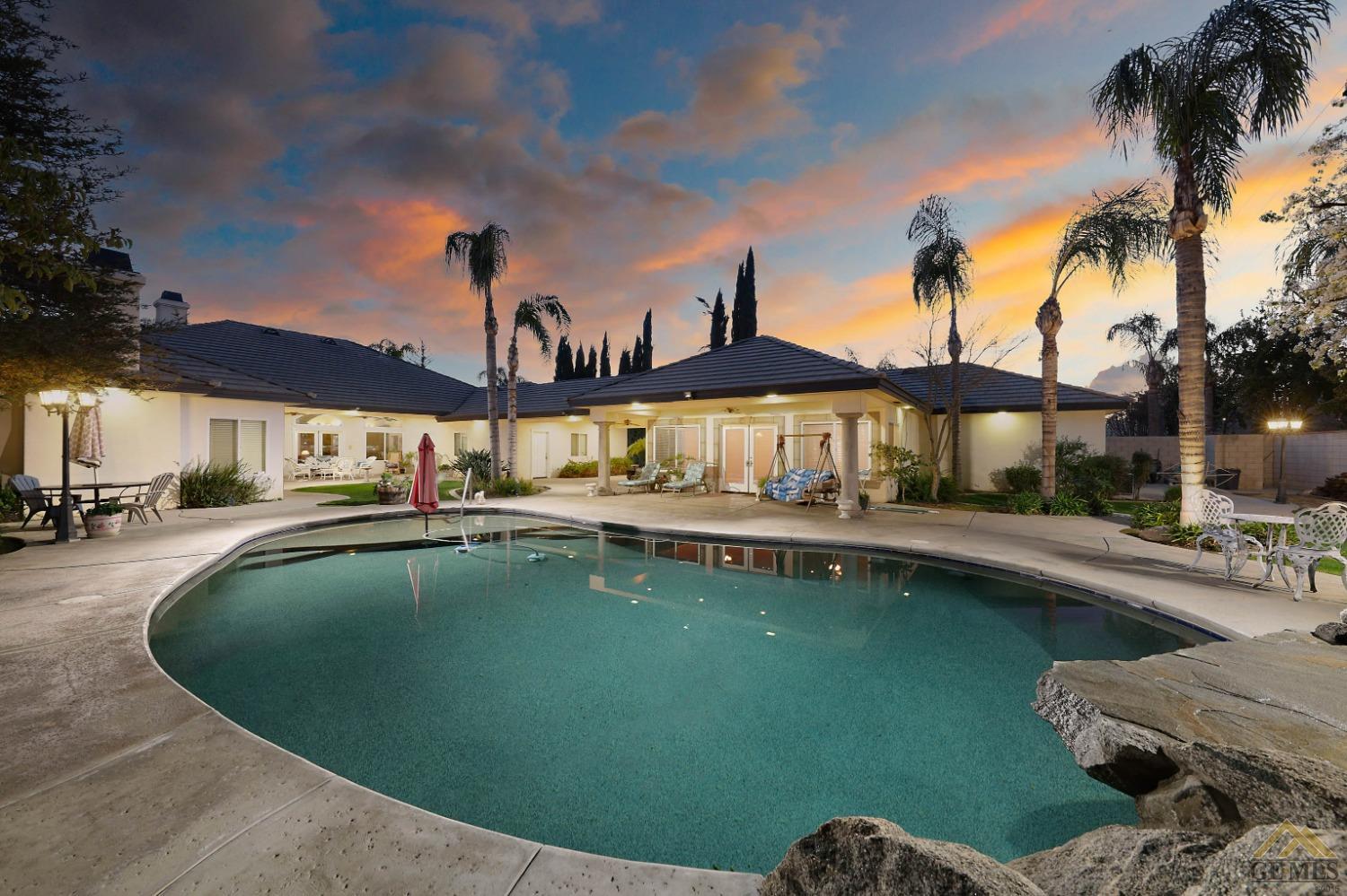 Undisclosed Address Bakersfield, CA 93312 - Photo 2 of 48 a view of a swimming pool and lounge chair