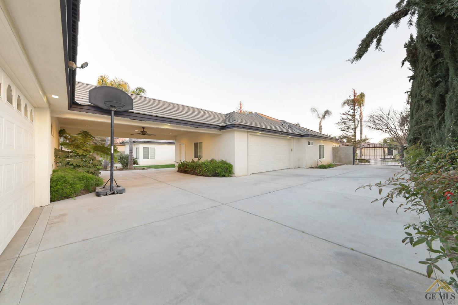 Undisclosed Address Bakersfield, CA 93312 - Photo 29 of 48 a view of a house with a street