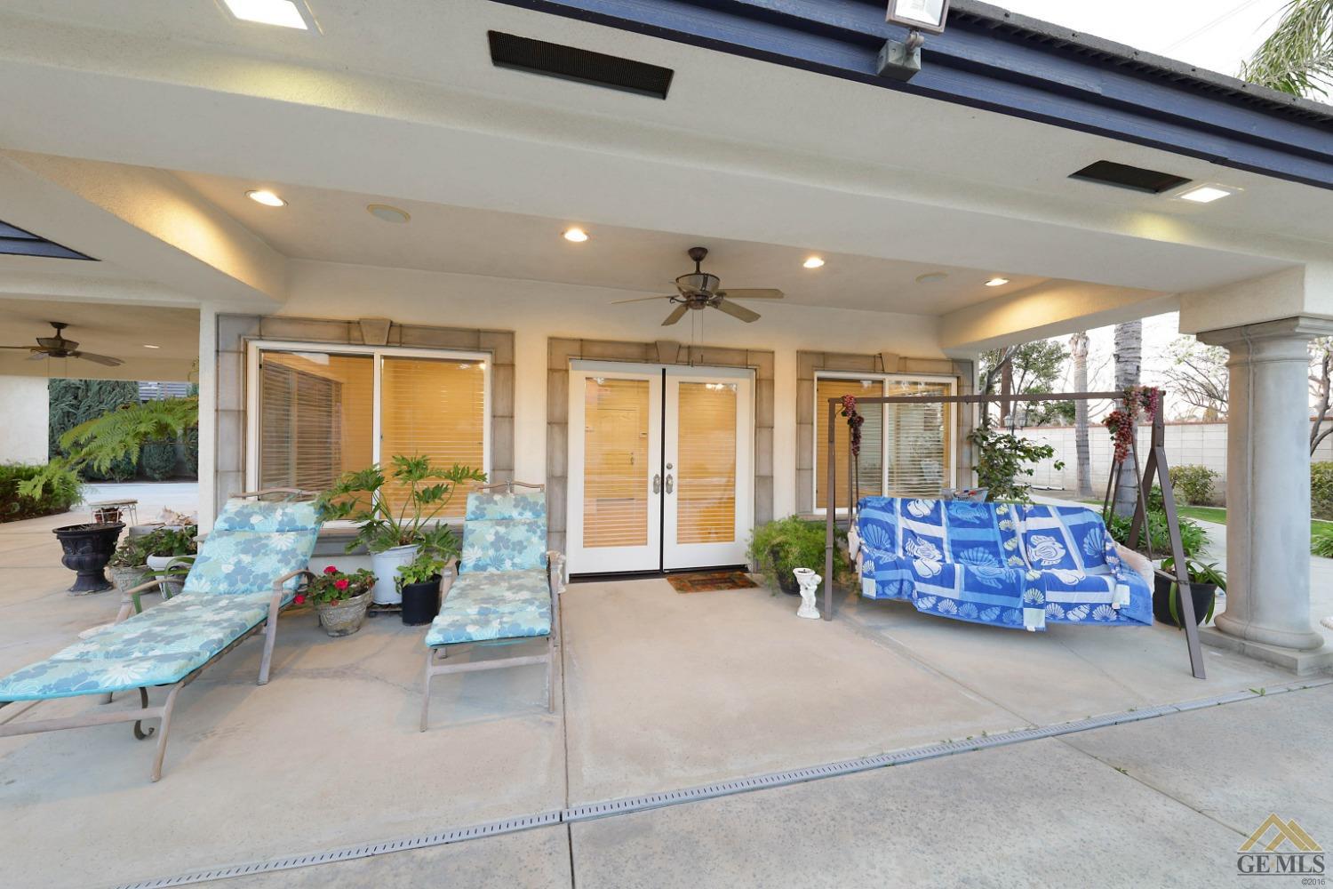 Undisclosed Address Bakersfield, CA 93312 - Photo 31 of 48 a living room with furniture and large windows