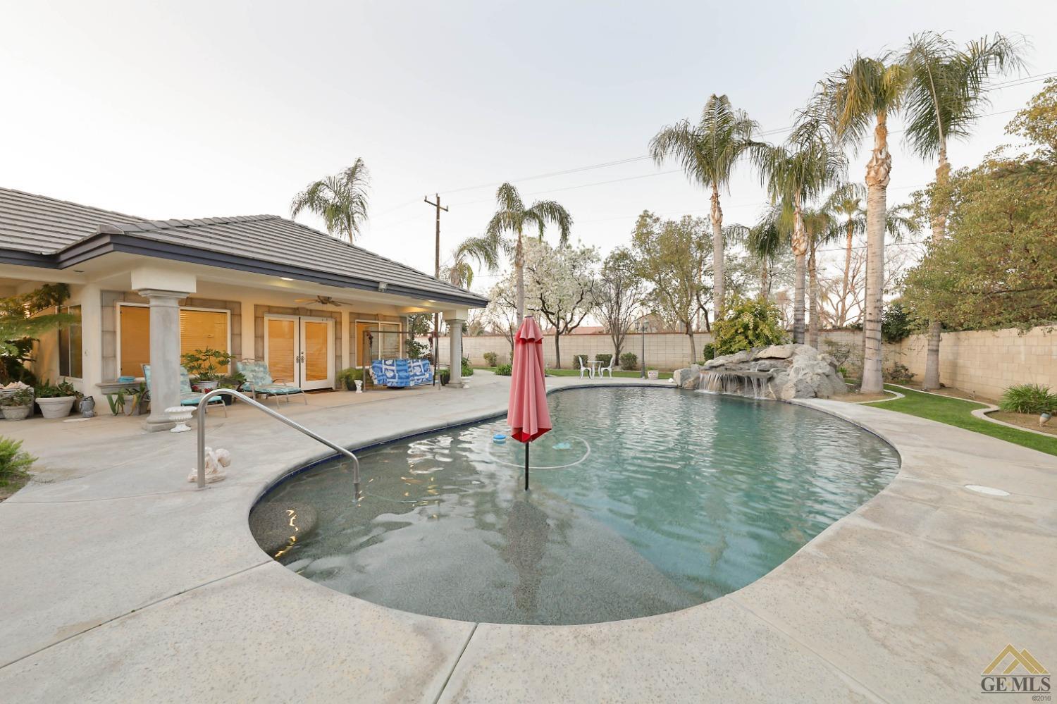 Undisclosed Address Bakersfield, CA 93312 - Photo 37 of 48 a view of a swimming pool with a patio