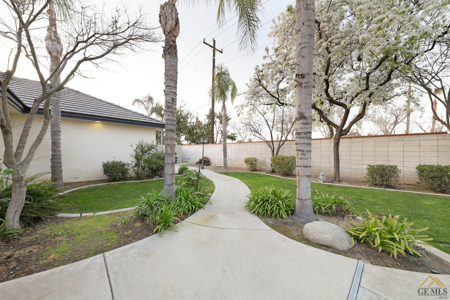Undisclosed Address Bakersfield, CA 93312 - Photo 39 of 48 a view of a back yard with flower plants