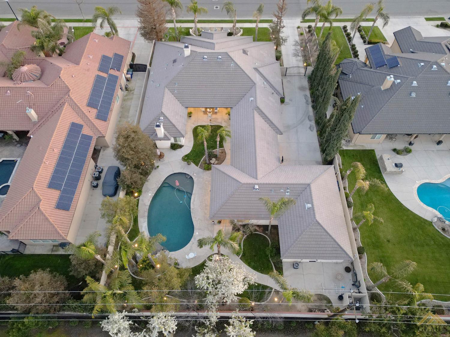 Undisclosed Address Bakersfield, CA 93312 - Photo 47 of 48 an aerial view of a house with a swimming pool