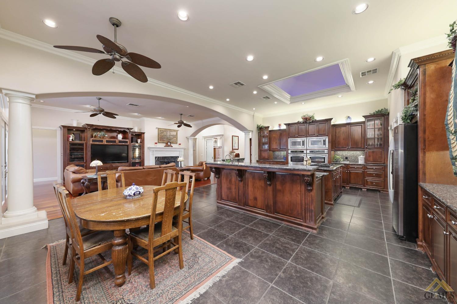 Undisclosed Address Bakersfield, CA 93312 - Photo 7 of 48 a kitchen with a table and chairs