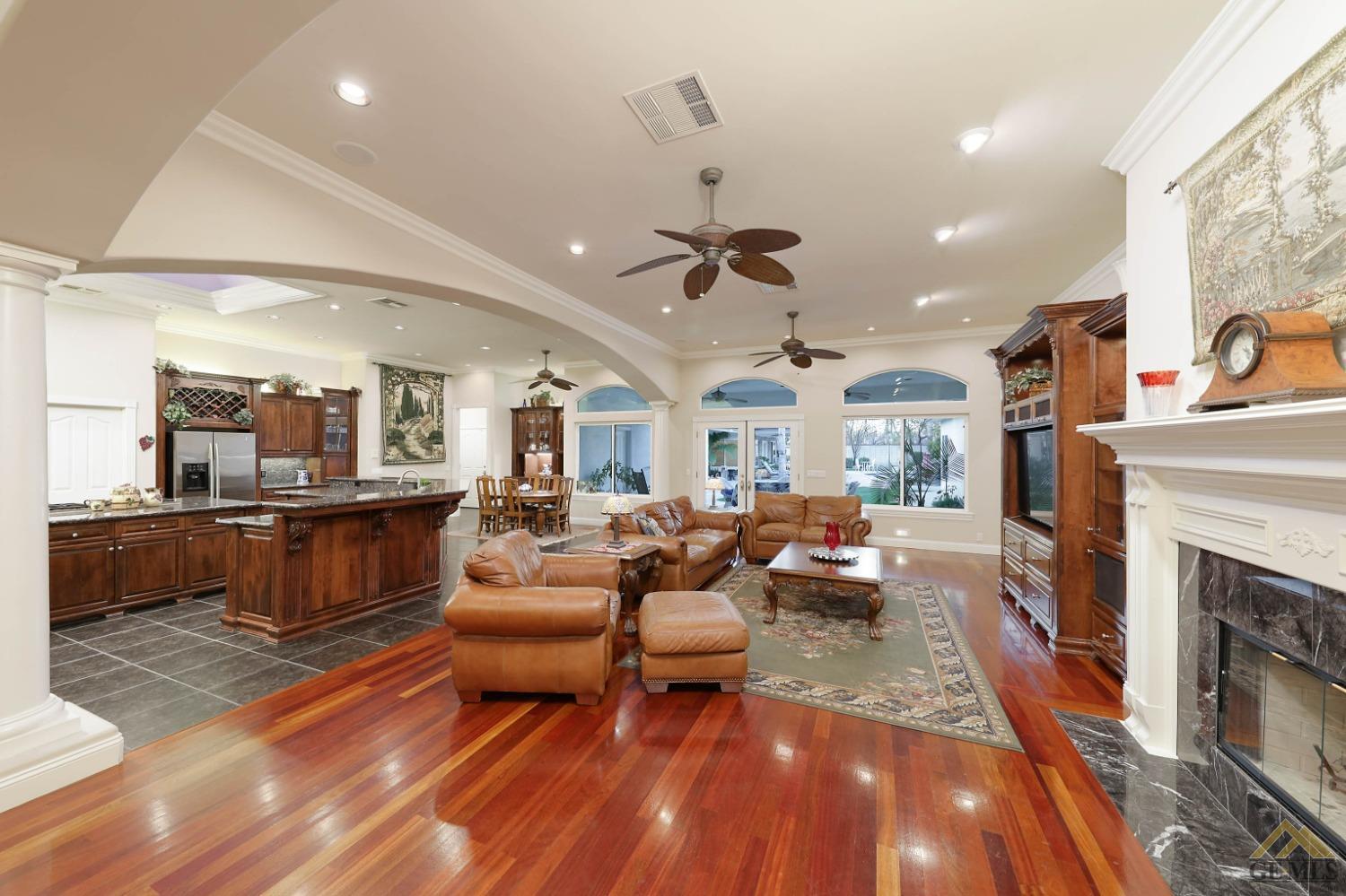 Undisclosed Address Bakersfield, CA 93312 - Photo 8 of 48 a living room with furniture and a fireplace