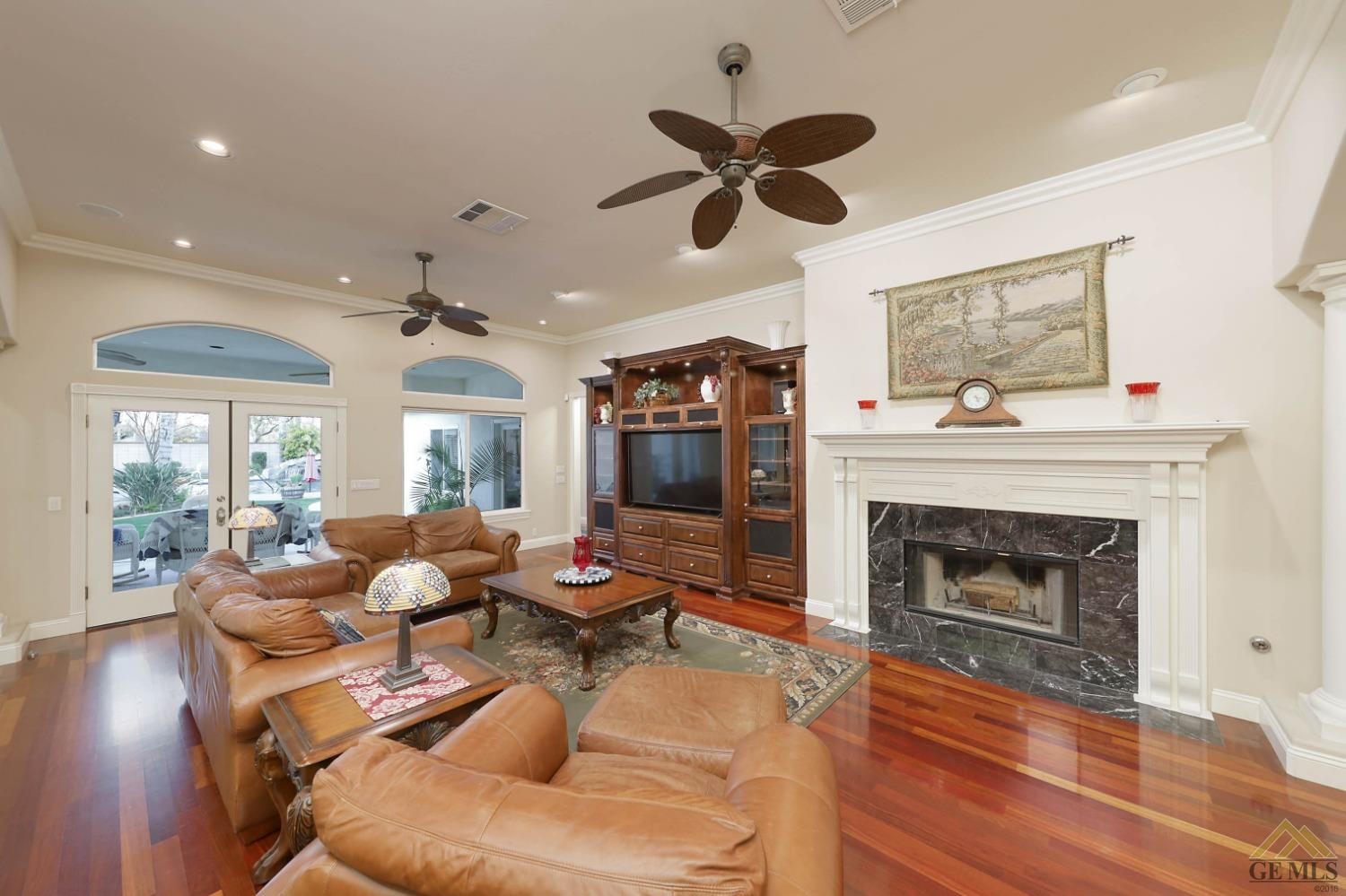 Undisclosed Address Bakersfield, CA 93312 - Photo 9 of 48 a living room with furniture and a fireplace