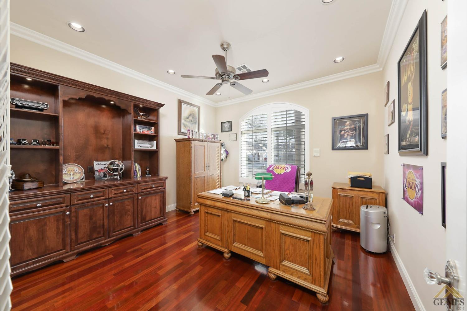 Undisclosed Address Bakersfield, CA 93312 - Photo 10 of 48 a room with furniture a large window and wooden floors