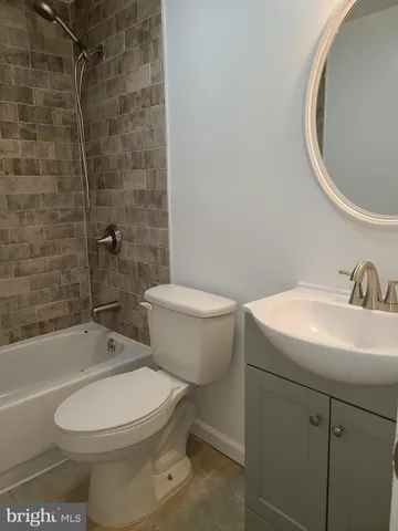 a toilet sitting next to a bathroom sink