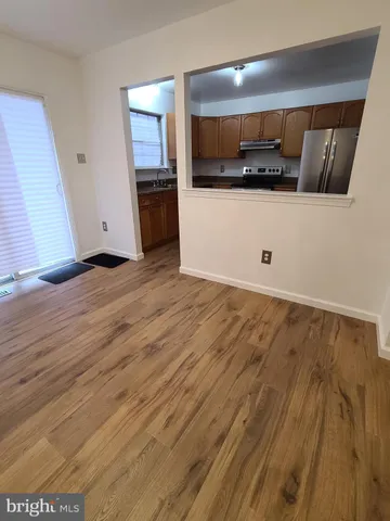 a view of a kitchen with a sink and a stove top oven