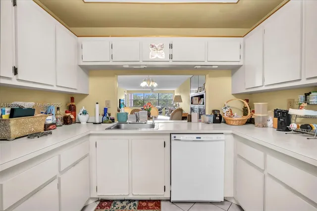 a kitchen with cabinets appliances and a sink