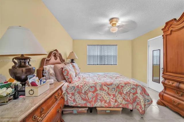 a bedroom with a bed and dresser