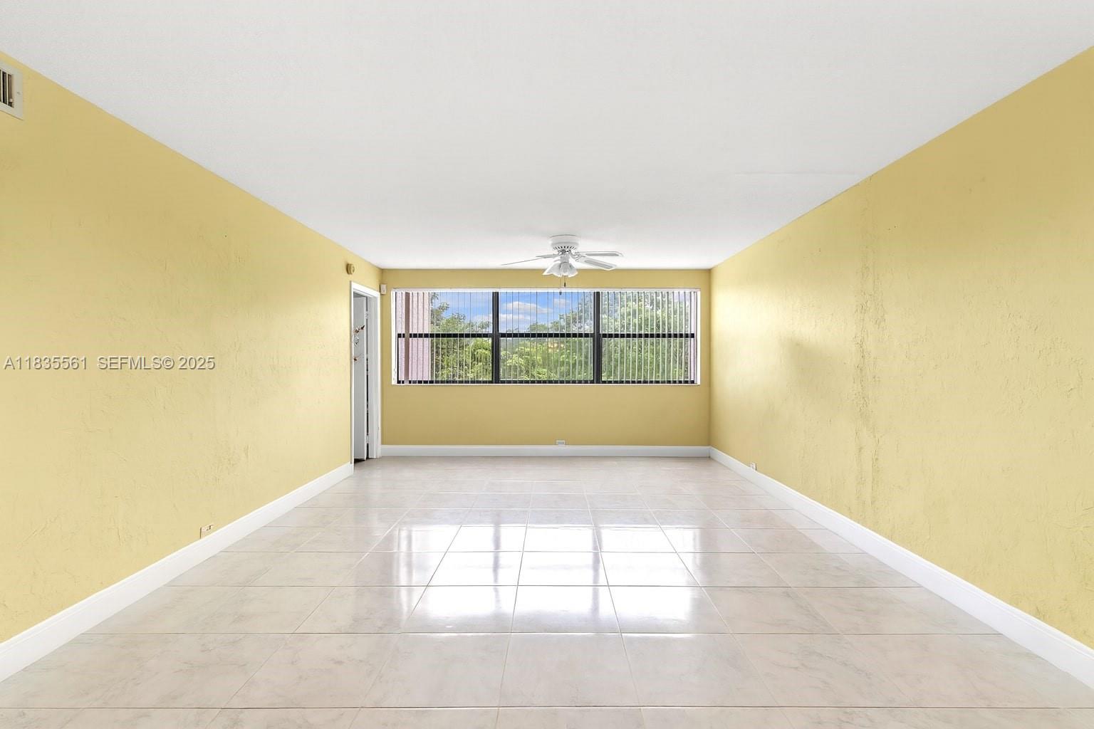 10400 Northwest 30th Court, Unit 305 Sunrise, FL 33322 - Photo 2 of 26 a view of an empty room with a window
