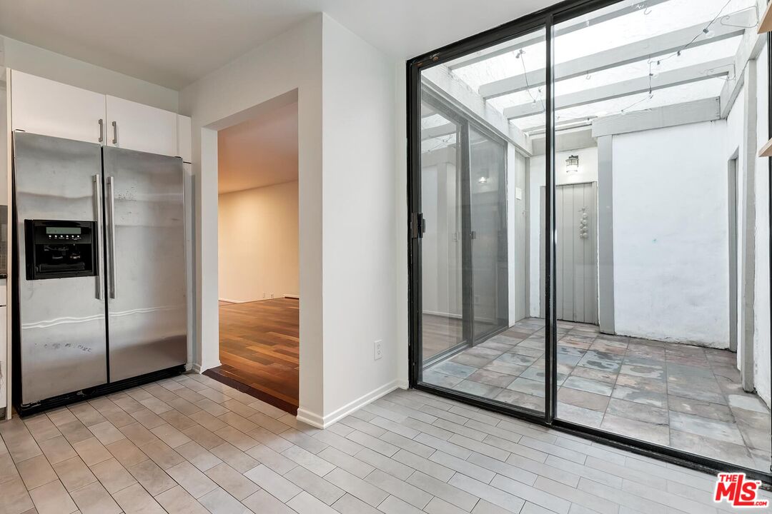 1013 21st Street, Unit B Santa Monica, CA 90403 - Photo 13 of 28 a view of a hallway with wooden floor and closet