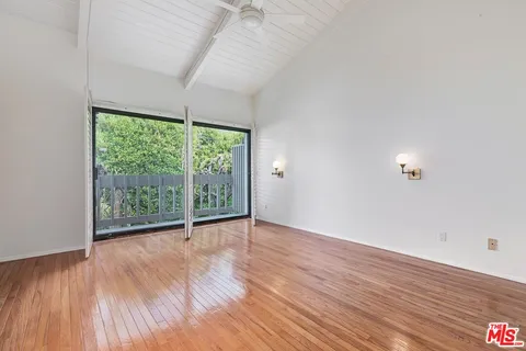 a view of a fence of the green space