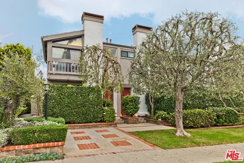 a view of a building with a yard