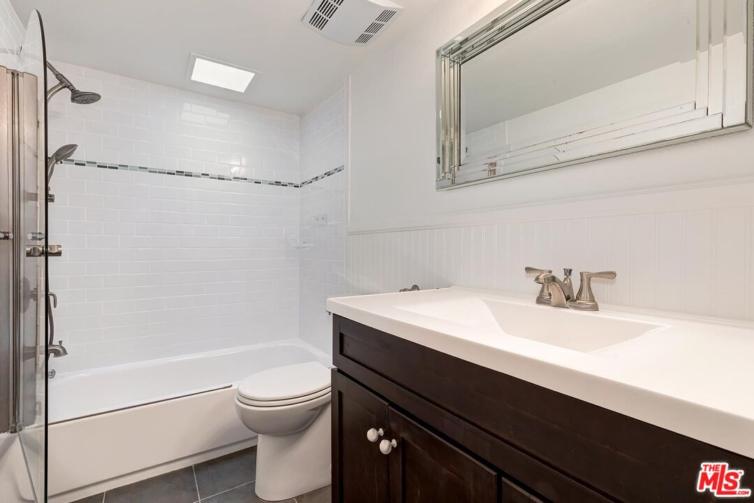 1013 21st Street, Unit B Santa Monica, CA 90403 - Photo 21 of 28 a bathroom with a sink a toilet and shower