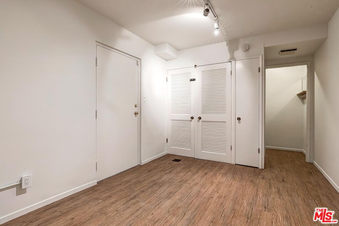 1013 21st Street, Unit B Santa Monica, CA 90403 - Photo 26 of 28 a view of empty room with wooden floor