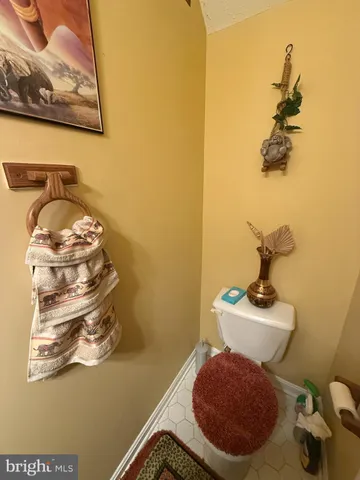 a bathroom with a sink mirror and vanity