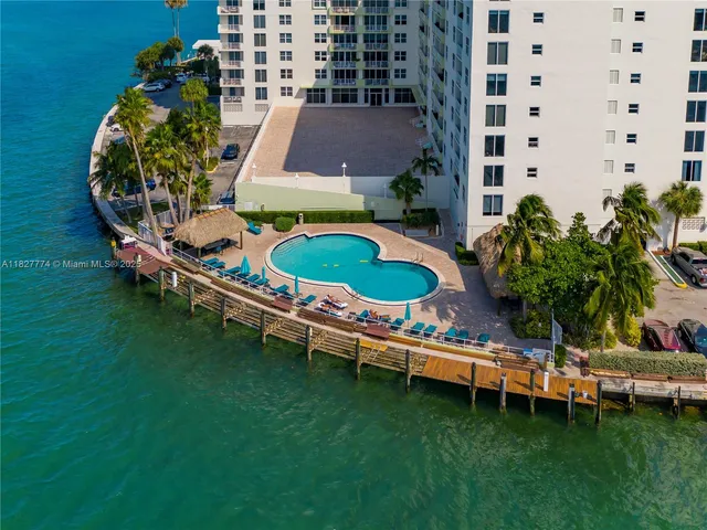 a backyard of a house with outdoor seating and a garden