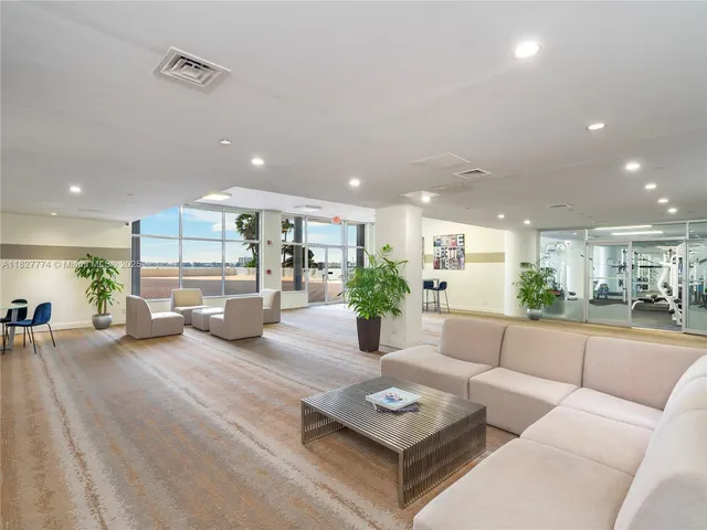 a living room with furniture and a table