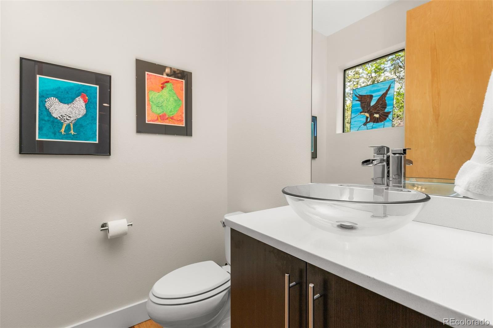 4515 West Moncrieff Place Denver, CO 80212 - Photo 11 of 29 a bathroom with a sink a mirror and toilet