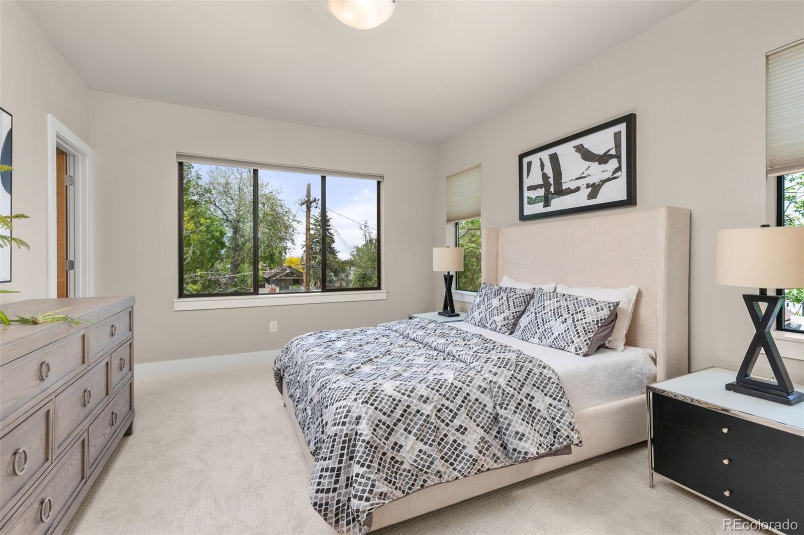 4515 West Moncrieff Place Denver, CO 80212 - Photo 19 of 29 a bedroom with a large bed and a window