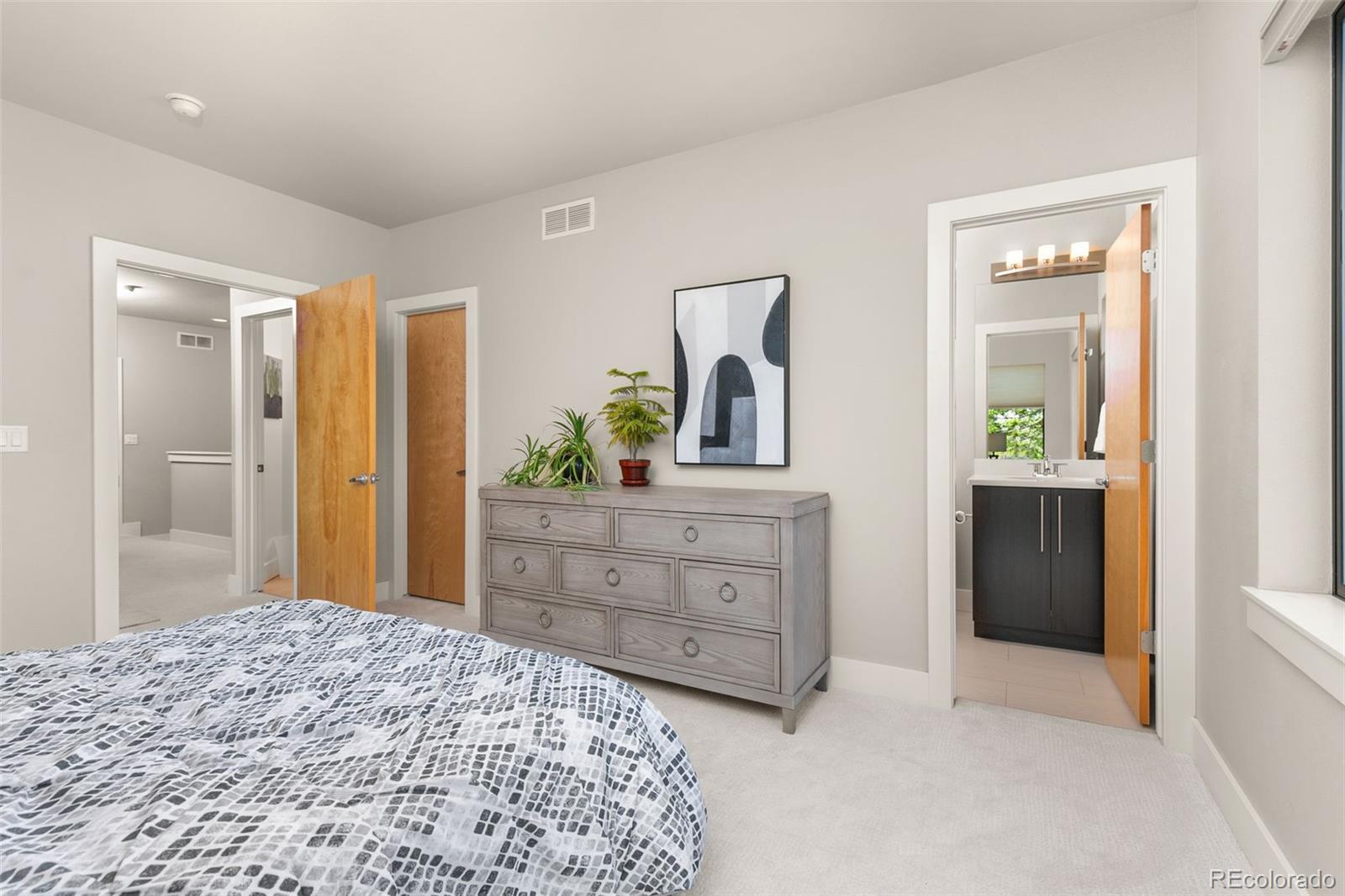 4515 West Moncrieff Place Denver, CO 80212 - Photo 20 of 29 a bedroom with a bed and a dresser