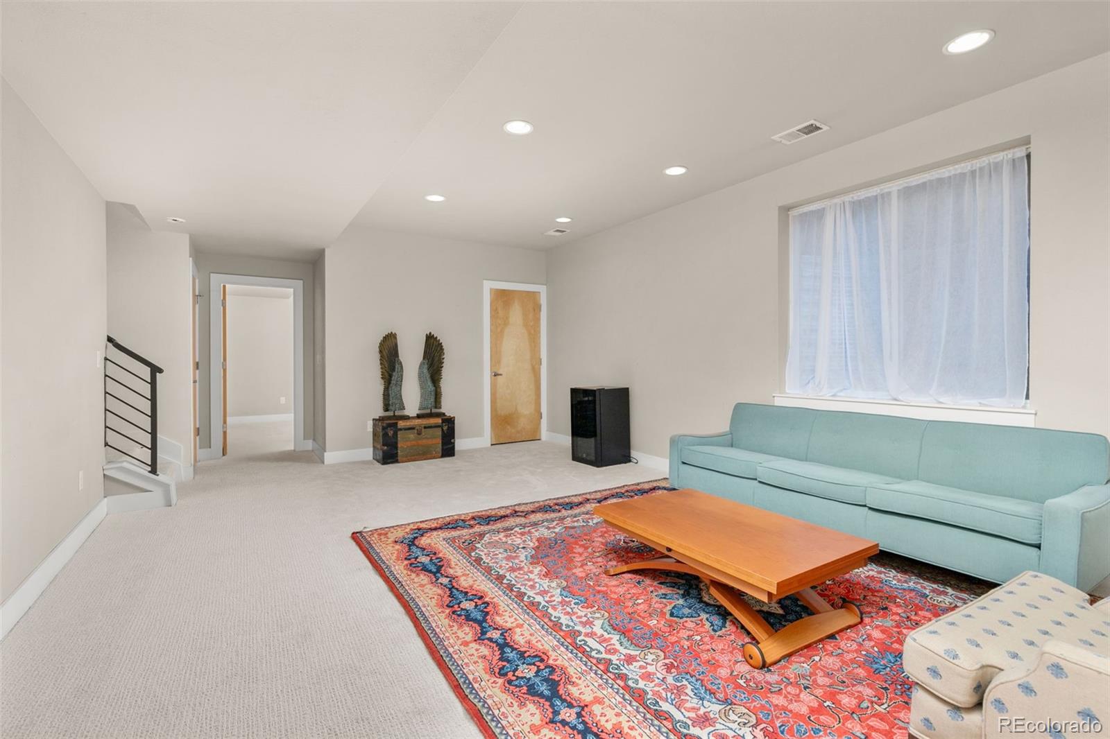 4515 West Moncrieff Place Denver, CO 80212 - Photo 22 of 29 a living room with furniture and a wooden floor