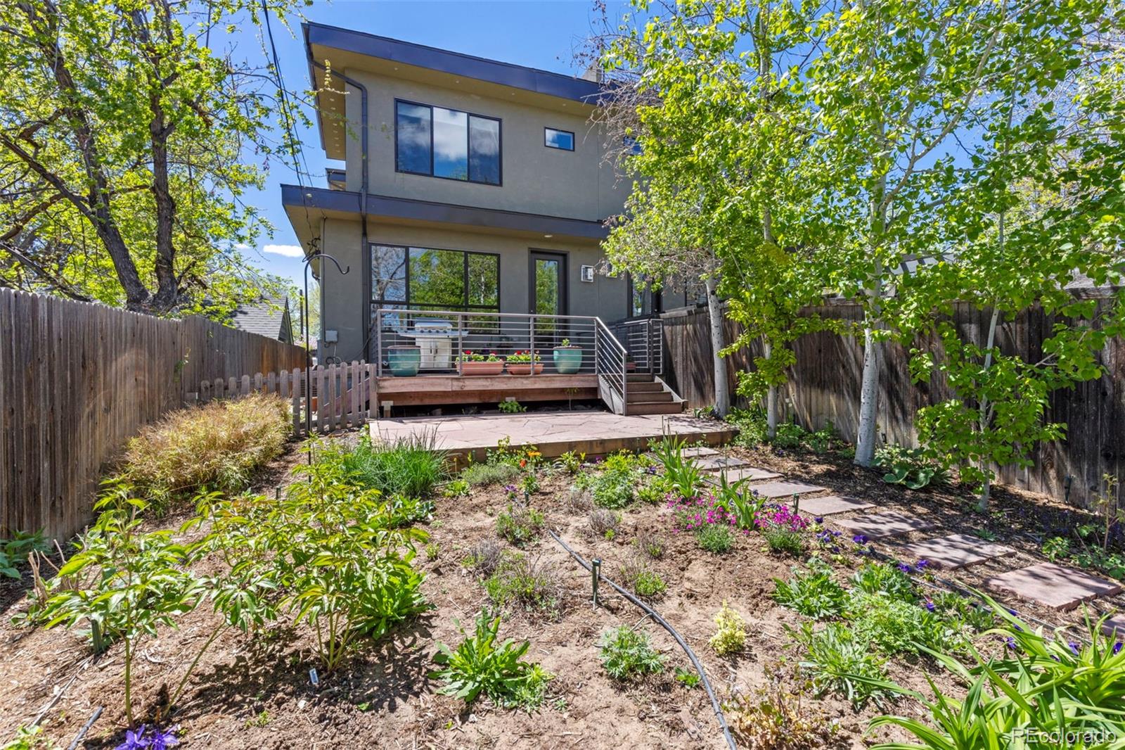 4515 West Moncrieff Place Denver, CO 80212 - Photo 28 of 29 a front view of a house with garden