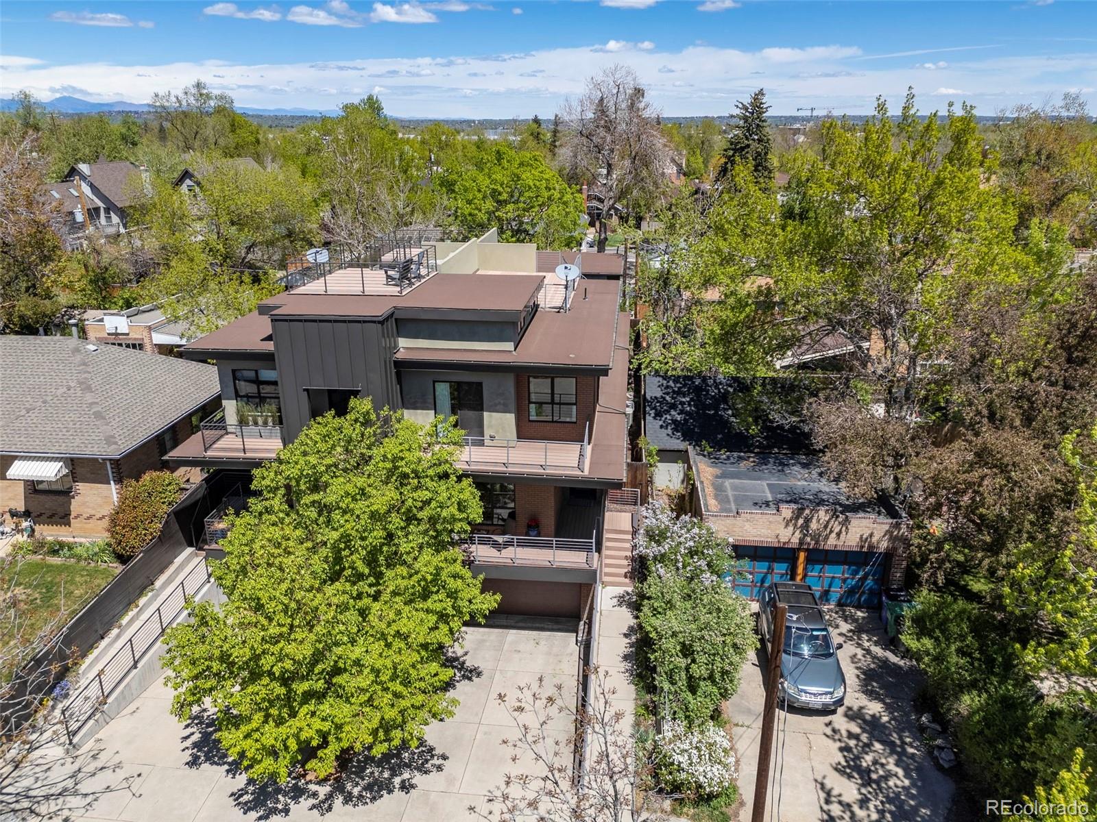 4515 West Moncrieff Place Denver, CO 80212 - Photo 4 of 29 an aerial view of a house with a yard and lake view