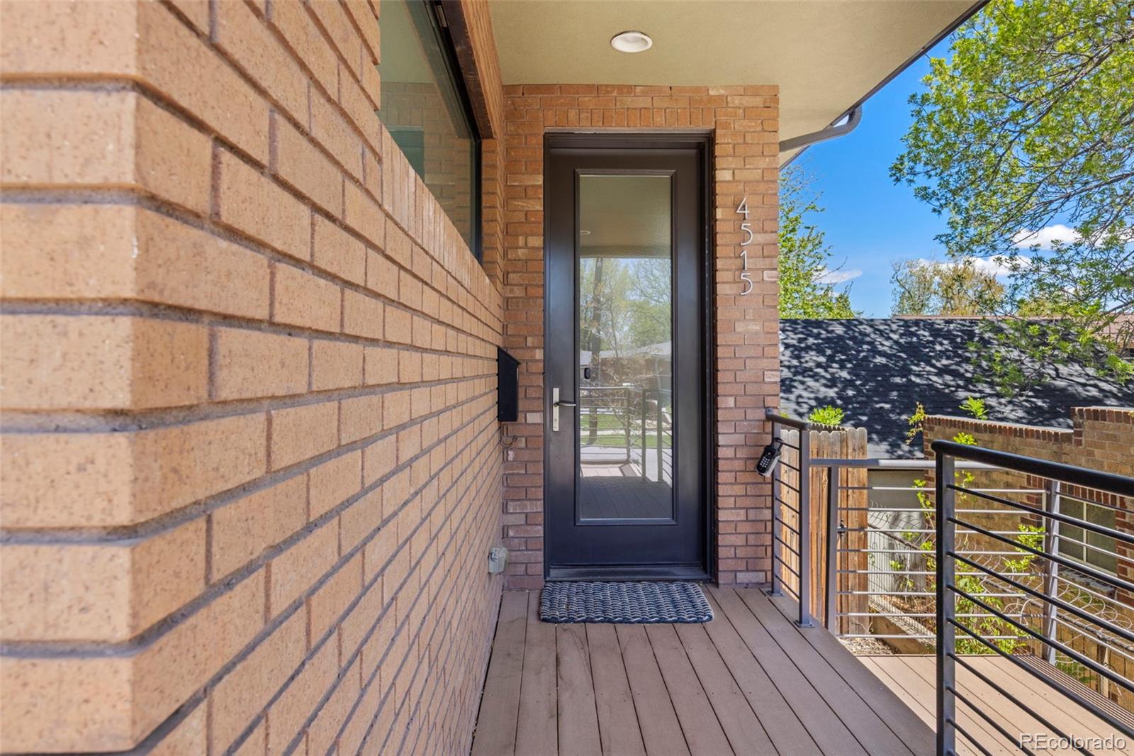 4515 West Moncrieff Place Denver, CO 80212 - Photo 5 of 29 a view of a balcony with wooden floor and plants