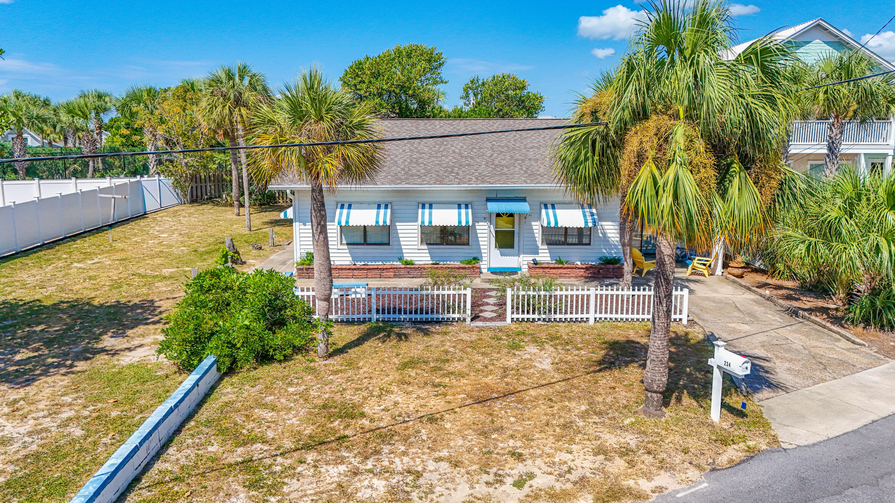 234 Sands Street Panama City Beach, FL 32413 - Photo 2 of 58 swimming pool with outdoor seating and yard