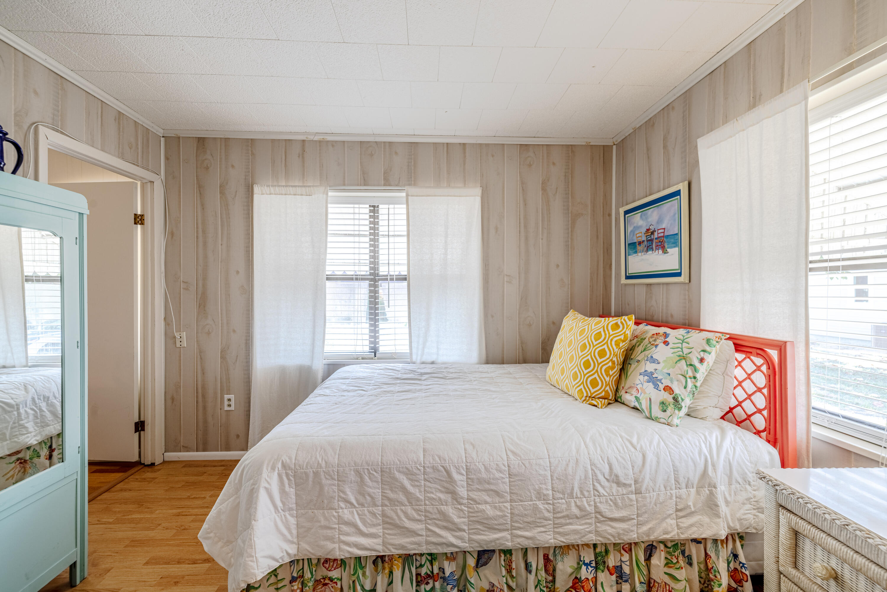 234 Sands Street Panama City Beach, FL 32413 - Photo 22 of 58 a bed sitting in a bedroom next to a window