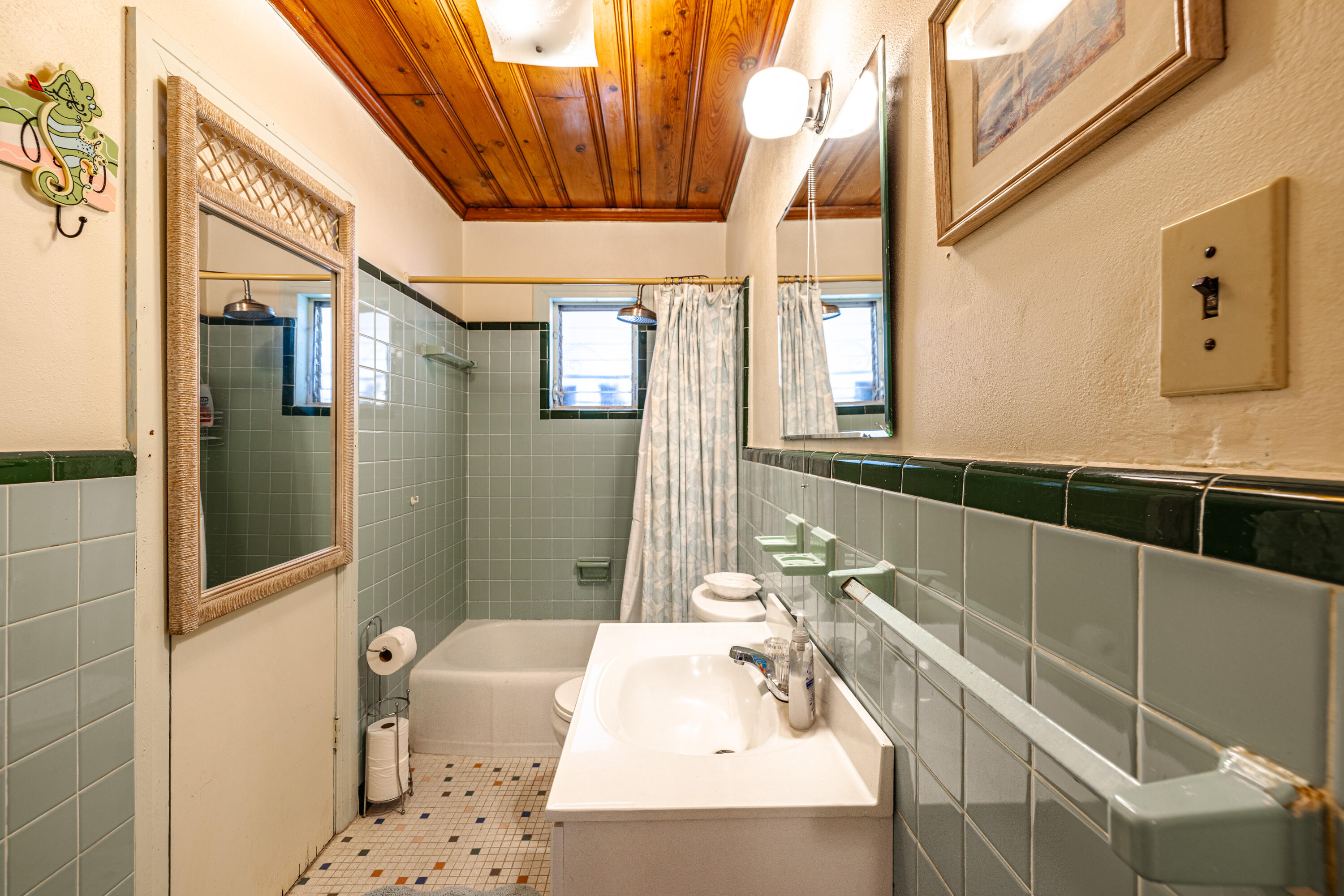234 Sands Street Panama City Beach, FL 32413 - Photo 29 of 58 a bathroom with a bathtub and shower