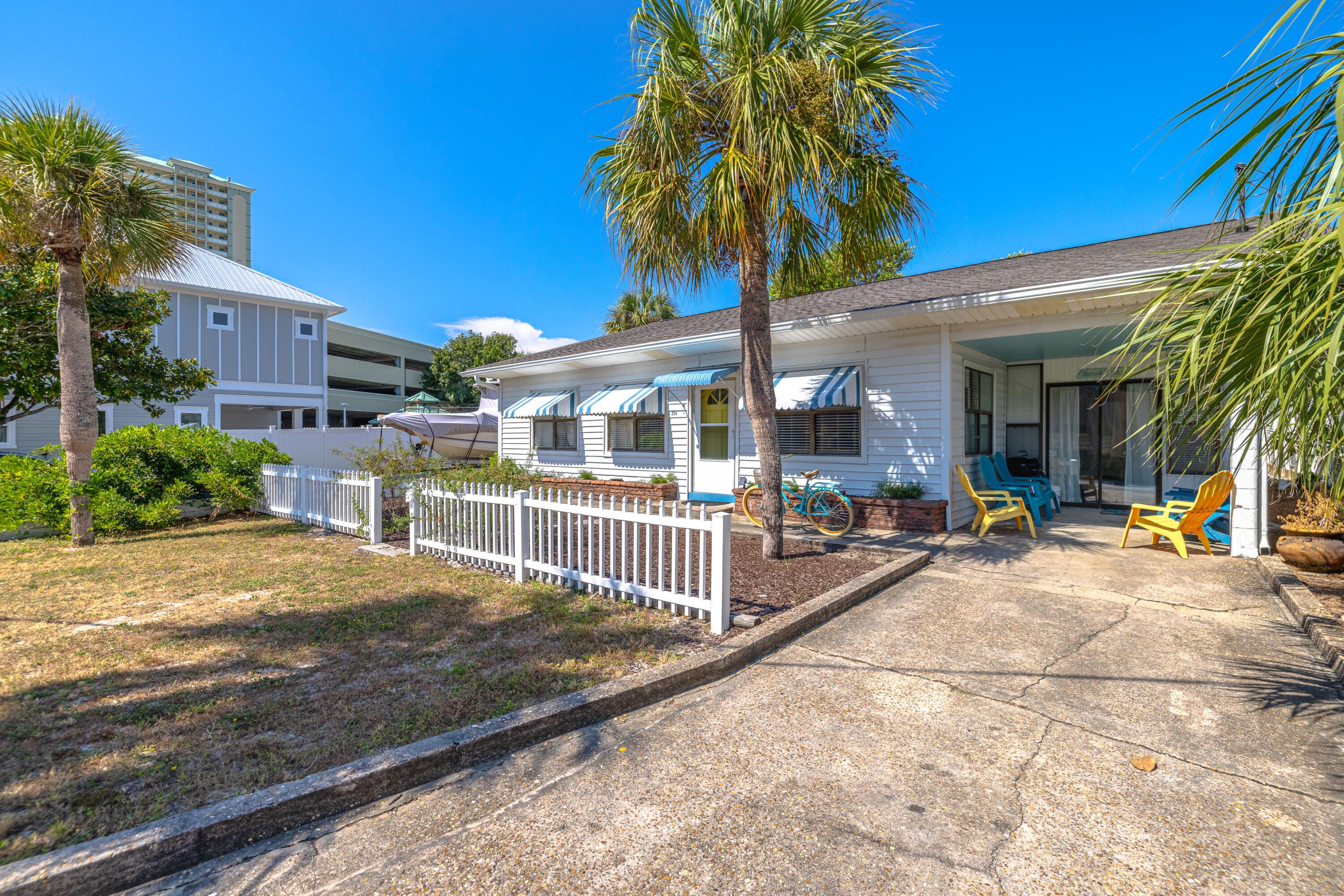 234 Sands Street Panama City Beach, FL 32413 - Photo 3 of 58 a view of a houses with a patio
