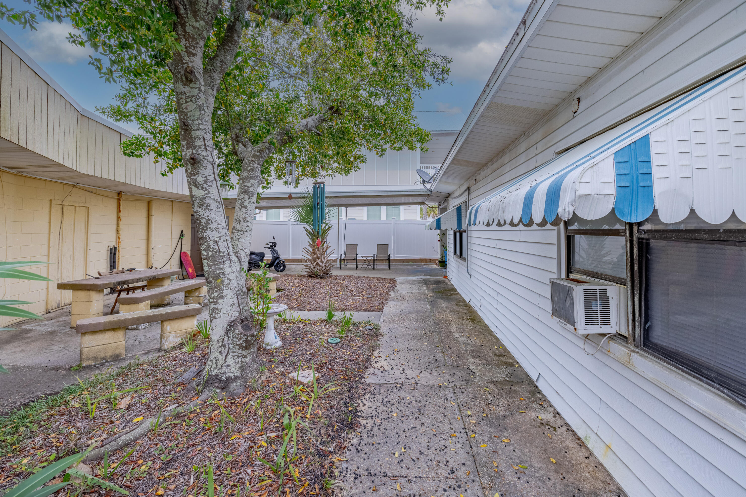 234 Sands Street Panama City Beach, FL 32413 - Photo 46 of 58 a view of a backyard with sitting area