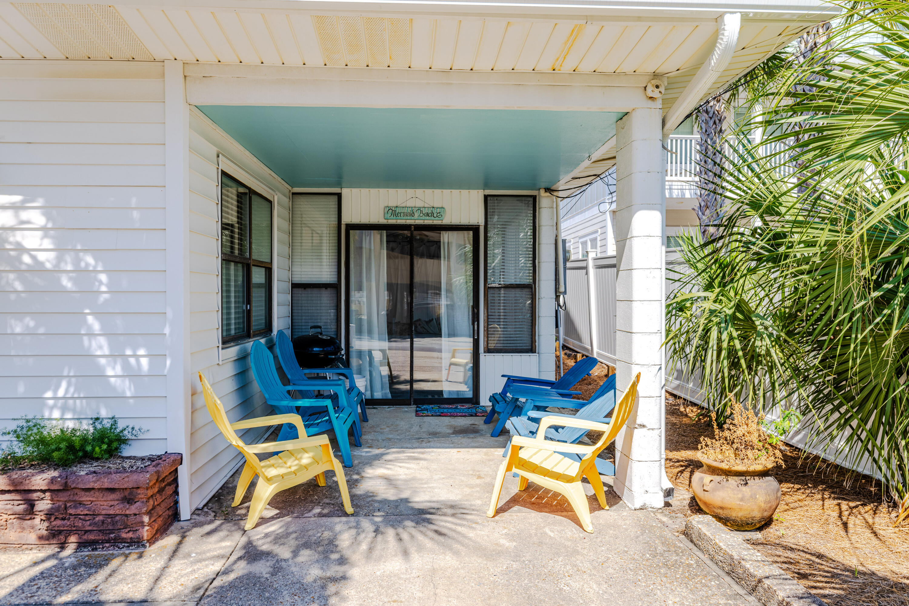 234 Sands Street Panama City Beach, FL 32413 - Photo 7 of 58 a backyard of a house with seating space