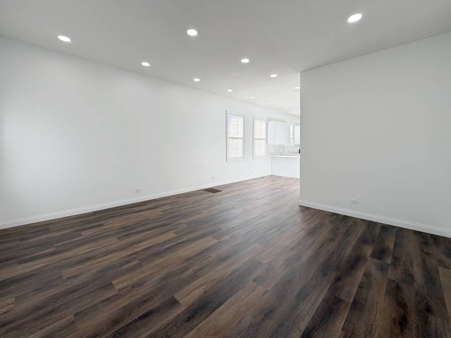 2982 South Lyman Street Chicago, IL 60608 - Photo 6 of 30 a view of an empty room with wooden floor and a window