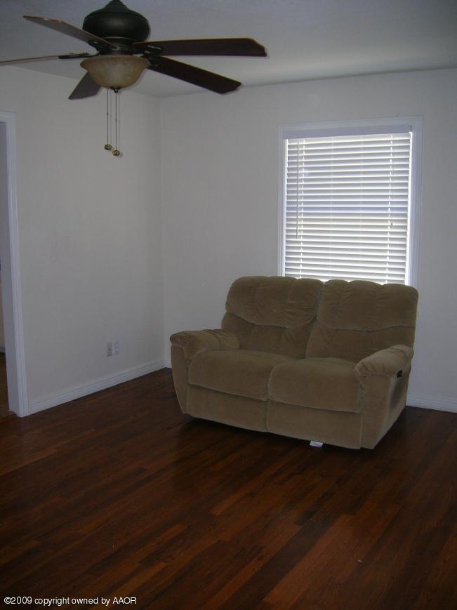 4116 South Lipscomb Street Amarillo, TX 79110 - Photo 3 of 10 a living room with hard wood floors and a wooden floor