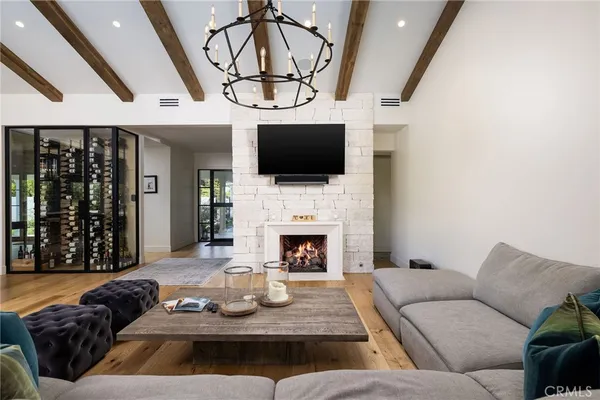 a living room with furniture and large windows