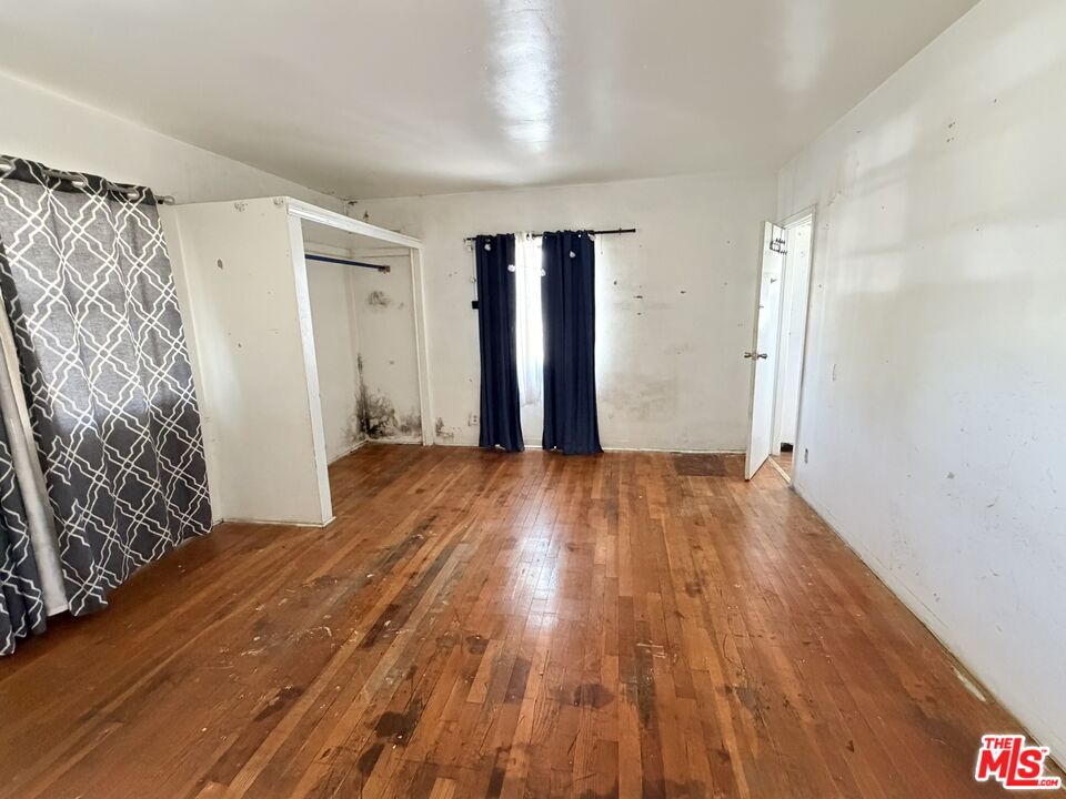 12918 Shreve Road Whittier, CA 90602 - Photo 27 of 42 a view of an empty room with closet and a window