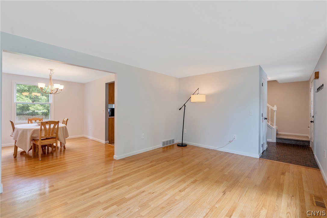 8069 Princess Path Clay, NY 13090 - Photo 5 of 50 The hardwoods flow into the formal dining room. T