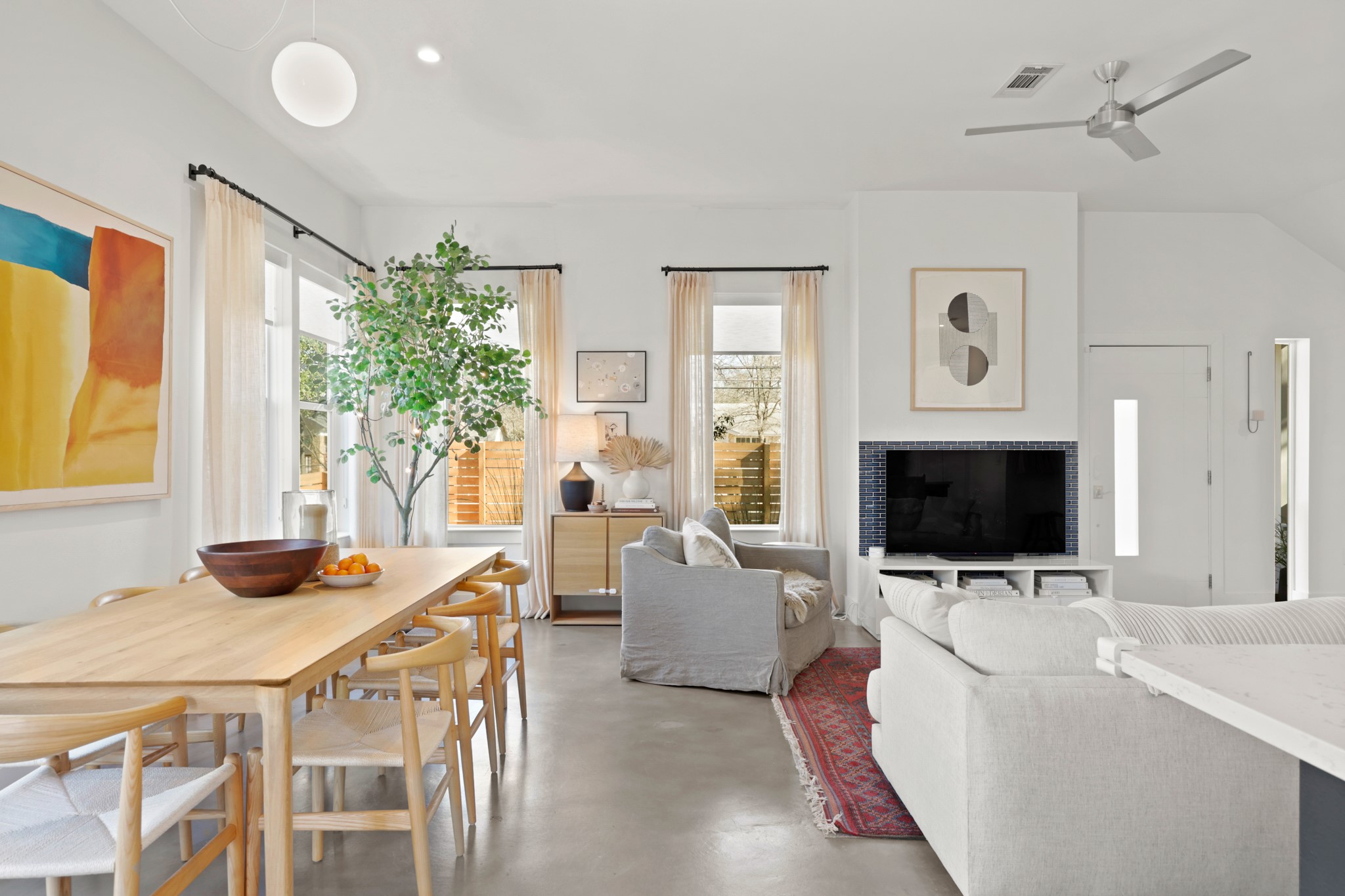 1102 1/2 Tillery Street, Unit 1 Austin, TX 78702 - Photo 14 of 38 a living room with furniture and a flat screen tv
